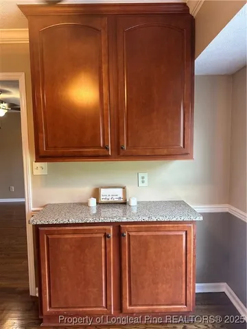 a bathroom with granite countertop cabinets and sink