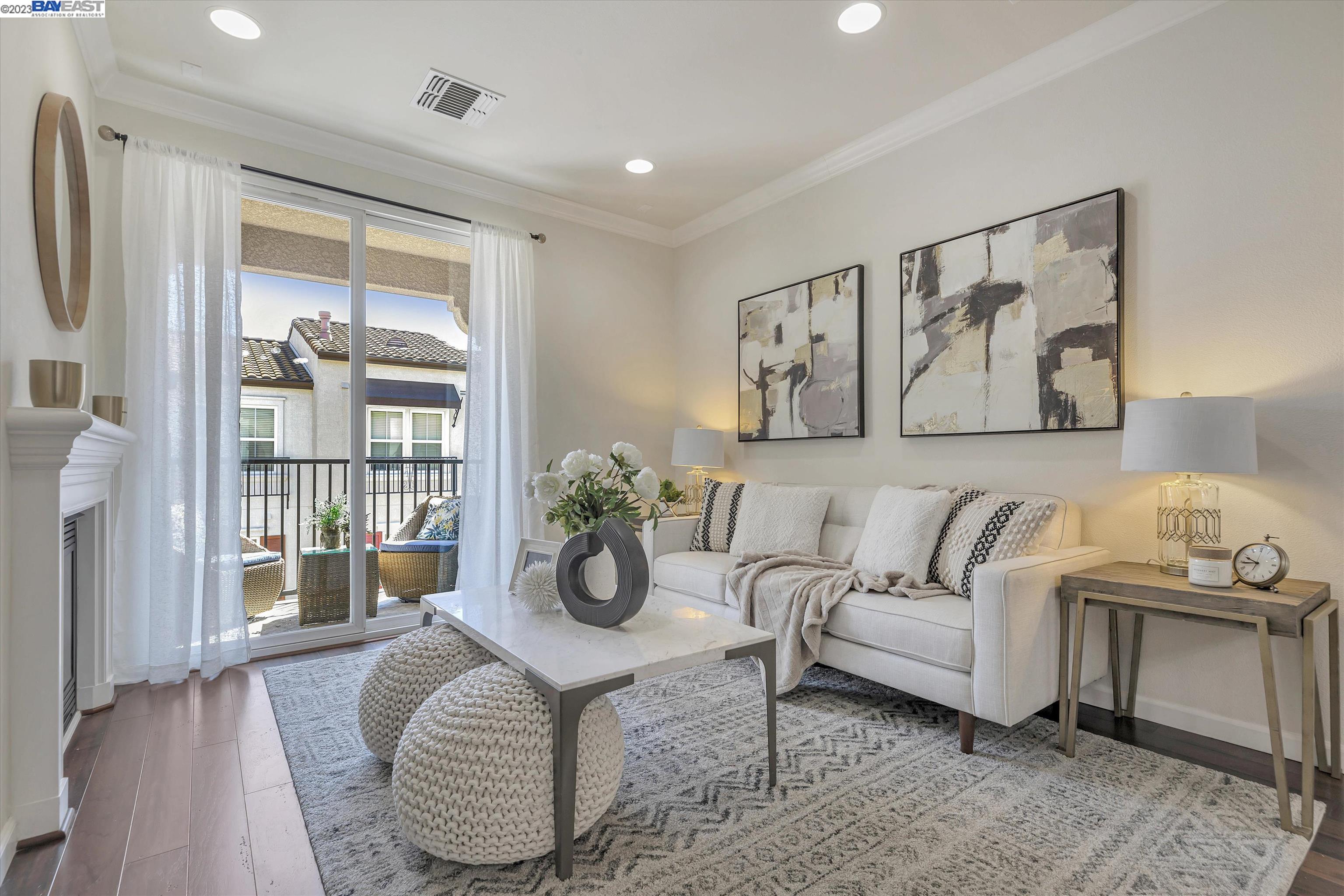 3465 Dublin Boulevard, Unit 416 Dublin, CA 94568 - Photo 1 of 1 a living room with furniture and a potted plant