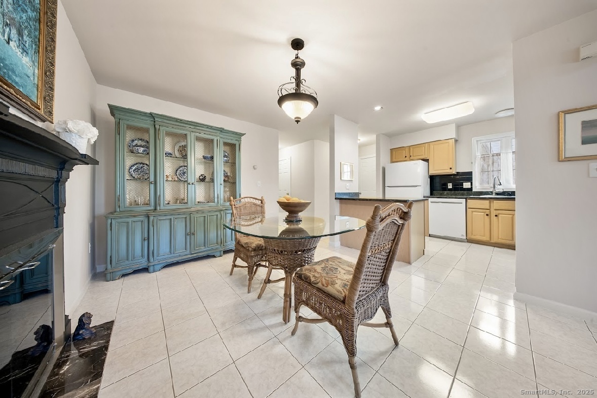 91 Forest Road, Unit B Milford, CT 06461 - Photo 12 of 28 a dining room with furniture and window