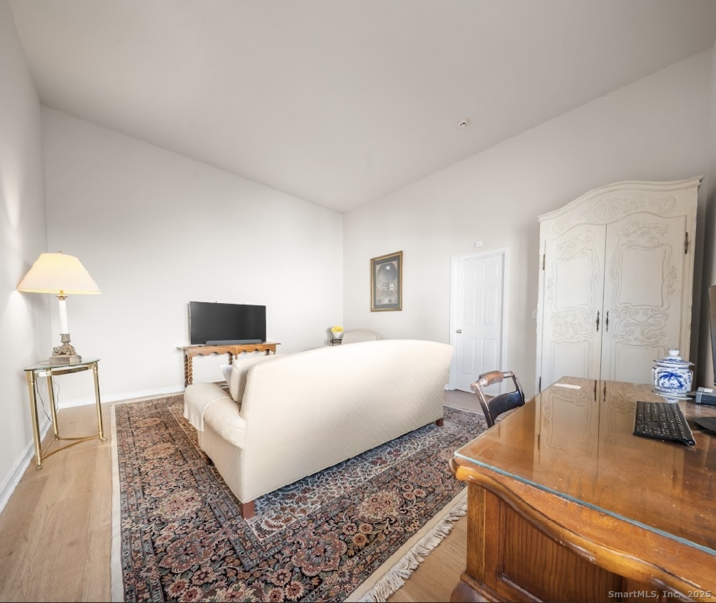 91 Forest Road, Unit B Milford, CT 06461 - Photo 21 of 28 a living room with furniture and a flat screen tv