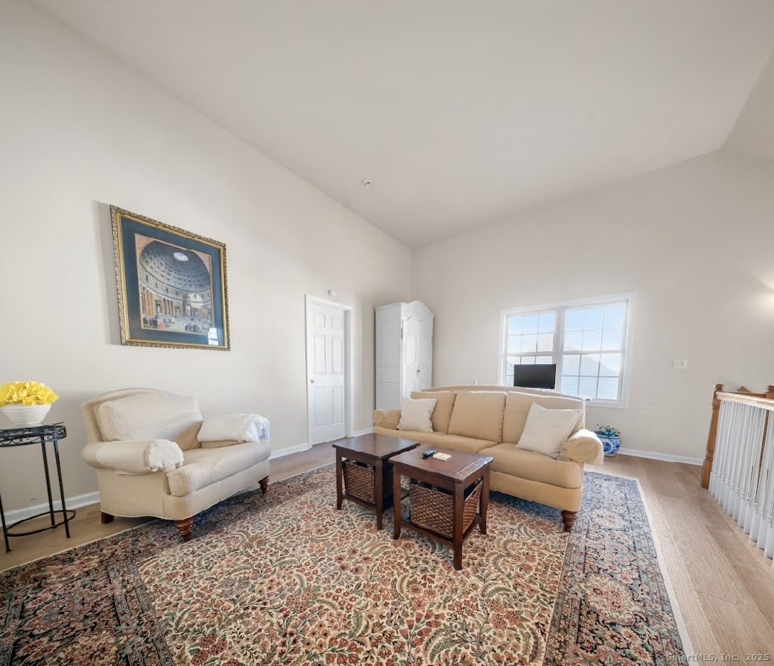 91 Forest Road, Unit B Milford, CT 06461 - Photo 22 of 28 a living room with furniture and a couch