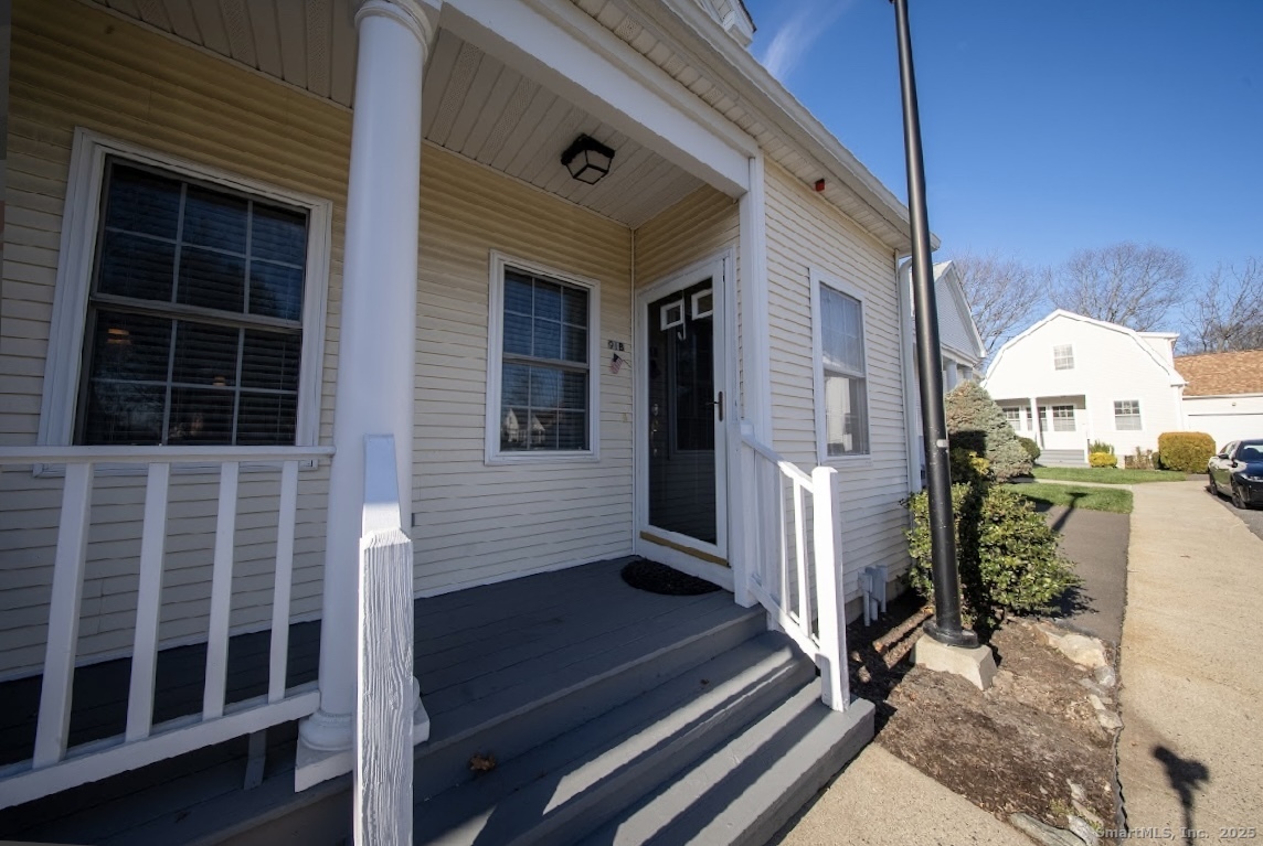 91 Forest Road, Unit B Milford, CT 06461 - Photo 4 of 28 a view of a house with a door and a window