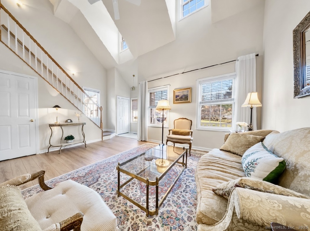 91 Forest Road, Unit B Milford, CT 06461 - Photo 6 of 28 a living room with furniture and a large window