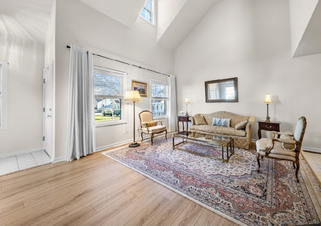 91 Forest Road, Unit B Milford, CT 06461 - Photo 8 of 28 a living room with furniture and a table