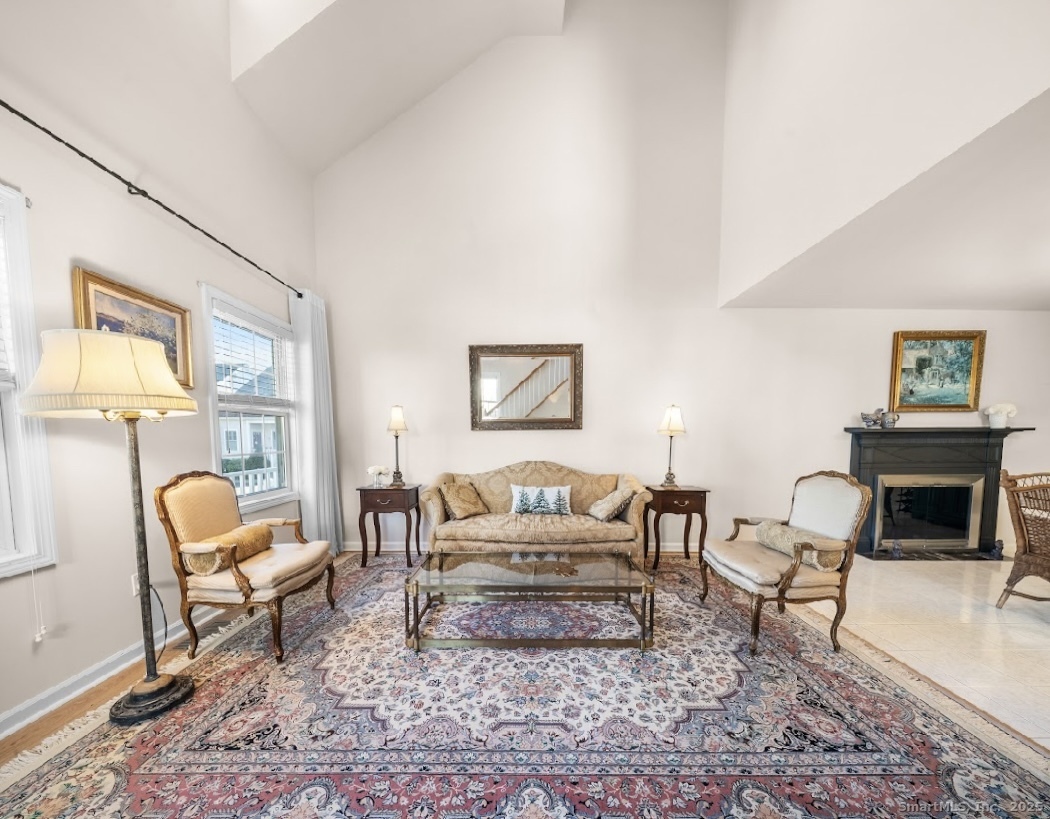 91 Forest Road, Unit B Milford, CT 06461 - Photo 9 of 28 a living room with furniture and a fireplace