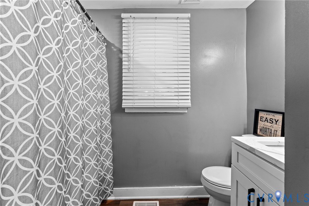 710 Hampton Road Petersburg, VA 23805 - Photo 13 of 24 Bathroom featuring a white vanity with black hardw