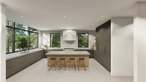 a dining room with furniture and a large window