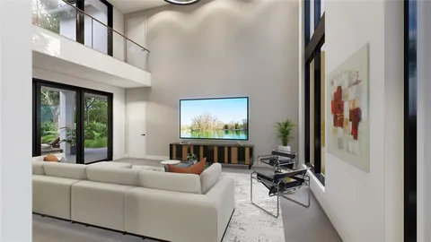 a living room with furniture a window and a flat screen tv