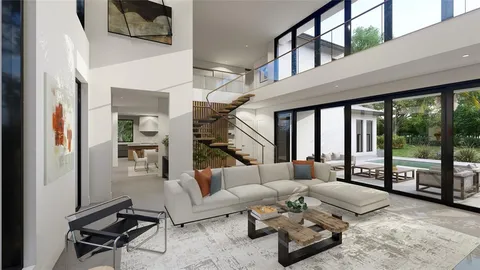 a living room with furniture and a floor to ceiling window