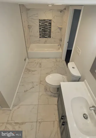 a bathroom with a sink and a shower