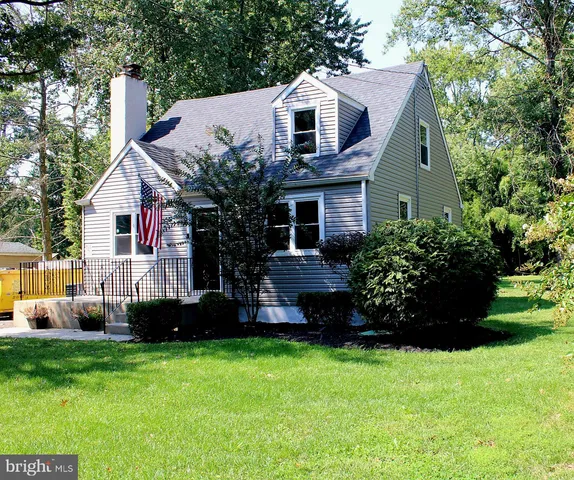 a front view of house with garden