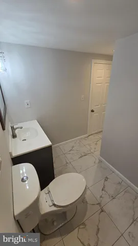 a bathroom with a toilet and a sink