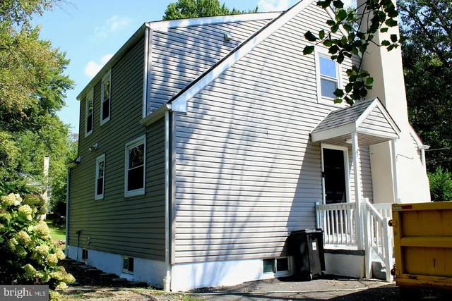 a view of front door and potted plants