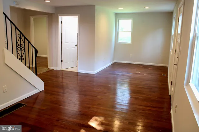 a view of an entryway with wooden floor