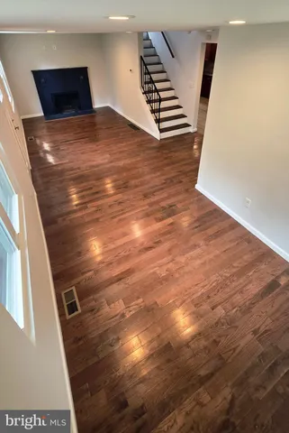 a view of an empty room with stairs