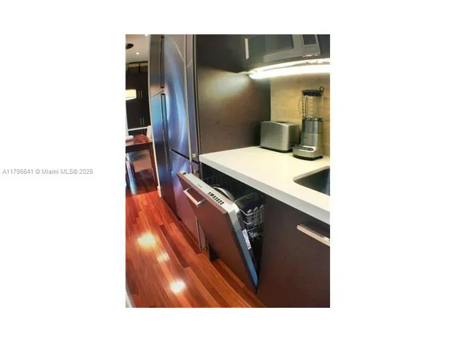 a en suite bathroom with a sink and mirror