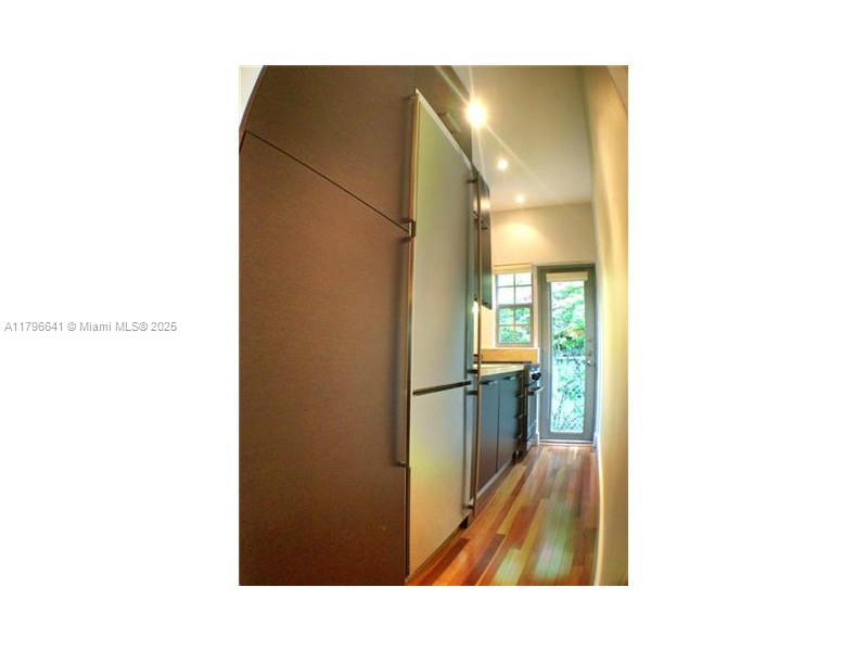 727 Jefferson Avenue, Unit 3 Miami Beach, FL 33139 - Photo 12 of 25 a open kitchen with a sink and a refrigerator