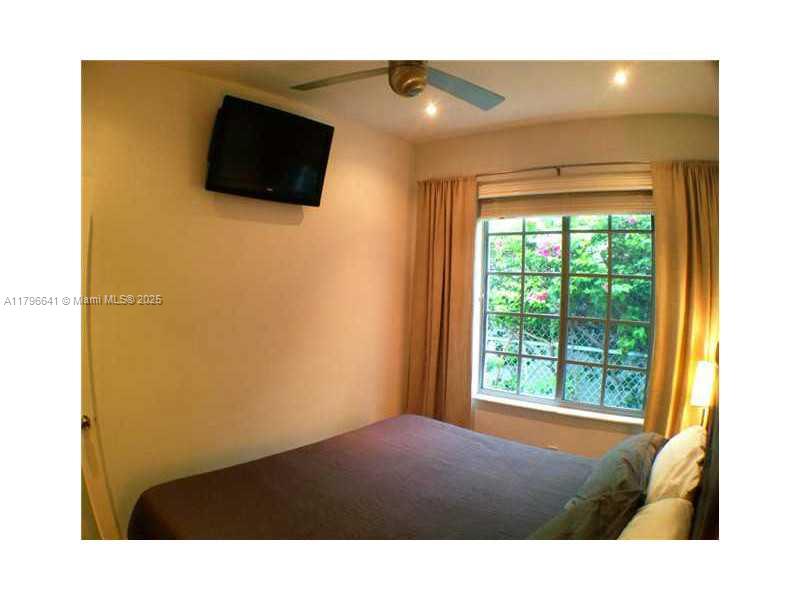 727 Jefferson Avenue, Unit 3 Miami Beach, FL 33139 - Photo 16 of 25 a bathroom with a sink and a mirror