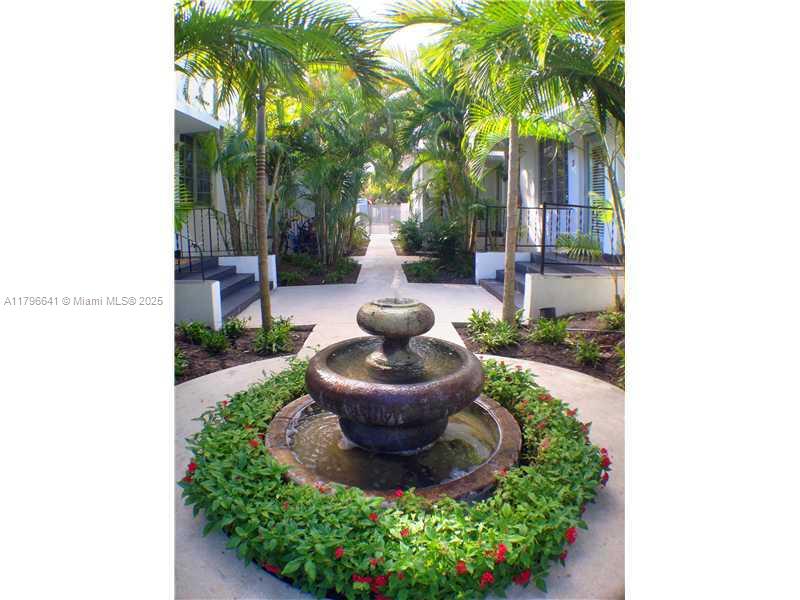 727 Jefferson Avenue, Unit 3 Miami Beach, FL 33139 - Photo 2 of 25 a view of a house with backyard and a garden
