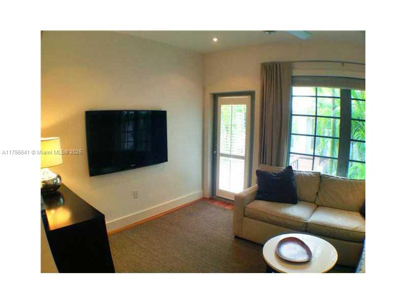 727 Jefferson Avenue, Unit 3 Miami Beach, FL 33139 - Photo 22 of 25 a living room with a couch