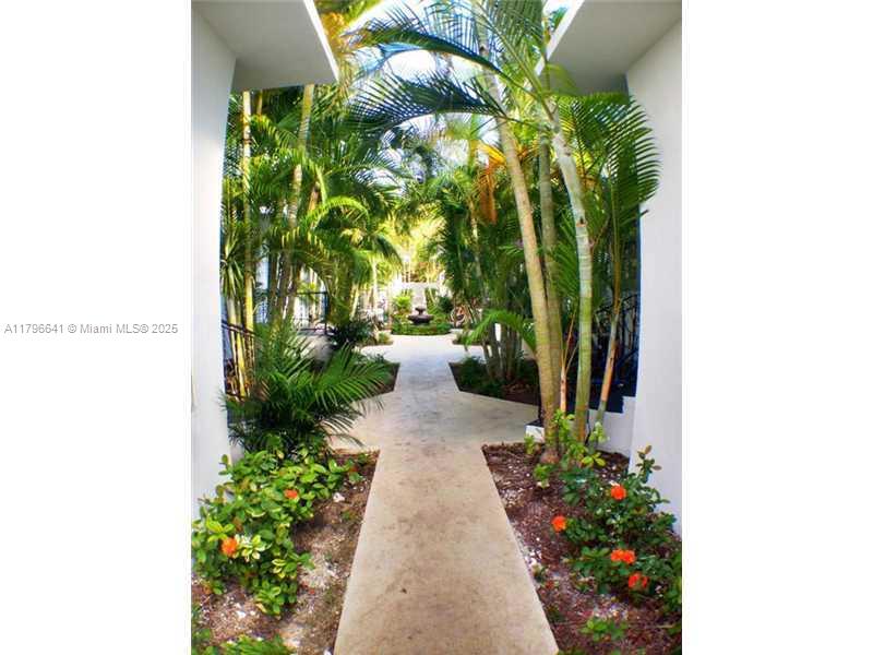 727 Jefferson Avenue, Unit 3 Miami Beach, FL 33139 - Photo 23 of 25 a view of a pathway with flower plants