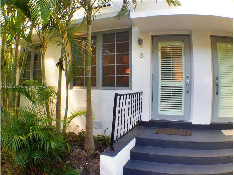 727 Jefferson Avenue, Unit 3 Miami Beach, FL 33139 - Photo 24 of 25 a front view of a house with a porch