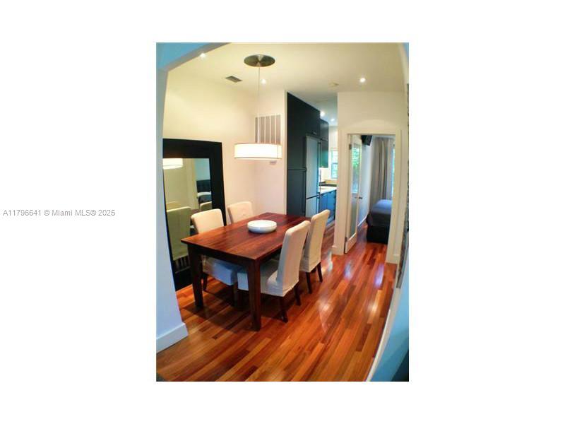 727 Jefferson Avenue, Unit 3 Miami Beach, FL 33139 - Photo 6 of 25 a living room with furniture and a dining table