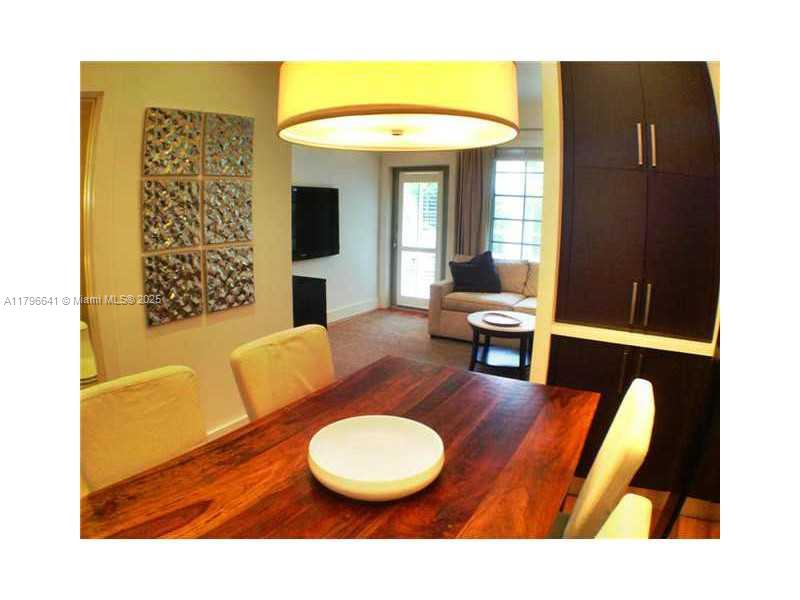 727 Jefferson Avenue, Unit 3 Miami Beach, FL 33139 - Photo 7 of 25 a living room with furniture and a large window