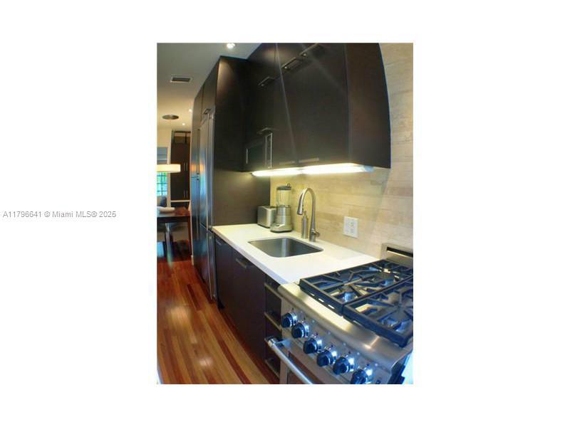 727 Jefferson Avenue, Unit 3 Miami Beach, FL 33139 - Photo 9 of 25 a bathroom with a sink and a mirror