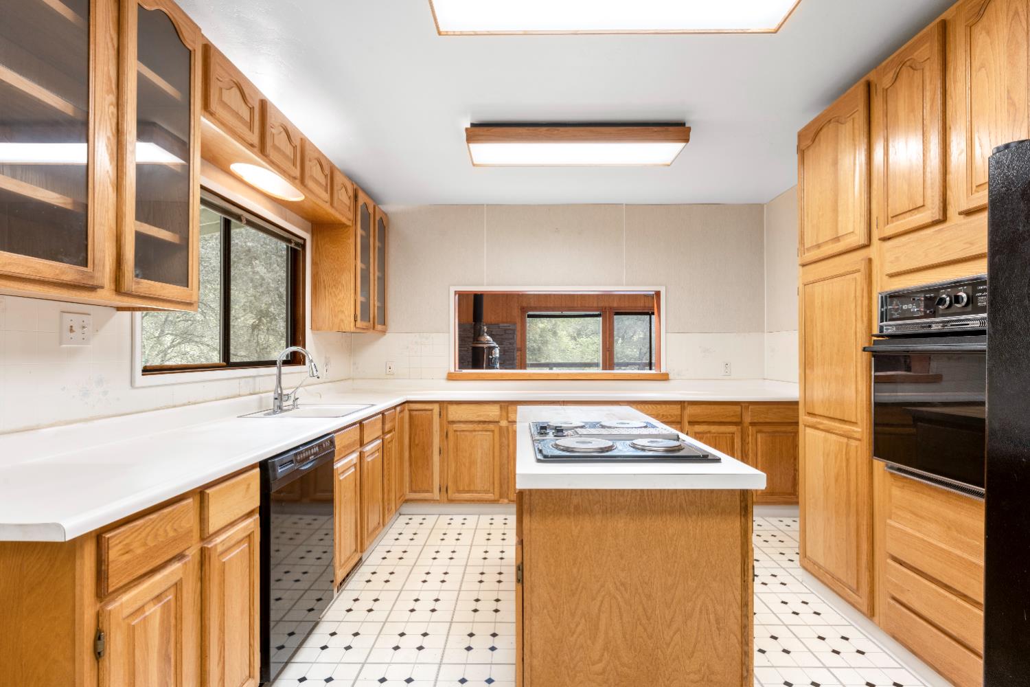 7321 Morning Canyon Road Placerville, CA 95667 - Photo 10 of 39 a kitchen with stainless steel appliances a stove a sink and a microwave