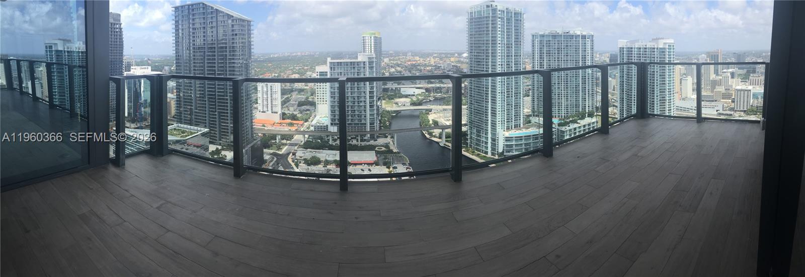 68 Southeast 6th Street, Unit 3412 Miami, FL 33131 - Photo 11 of 13 a view of a city from a balcony