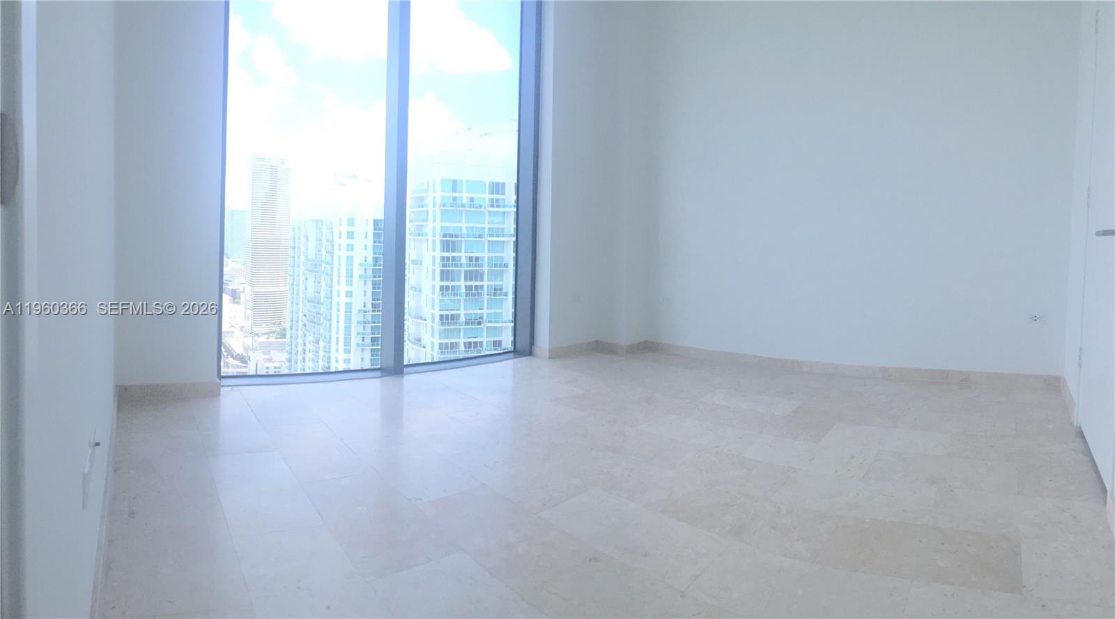 68 Southeast 6th Street, Unit 3412 Miami, FL 33131 - Photo 3 of 13 a view of room with window