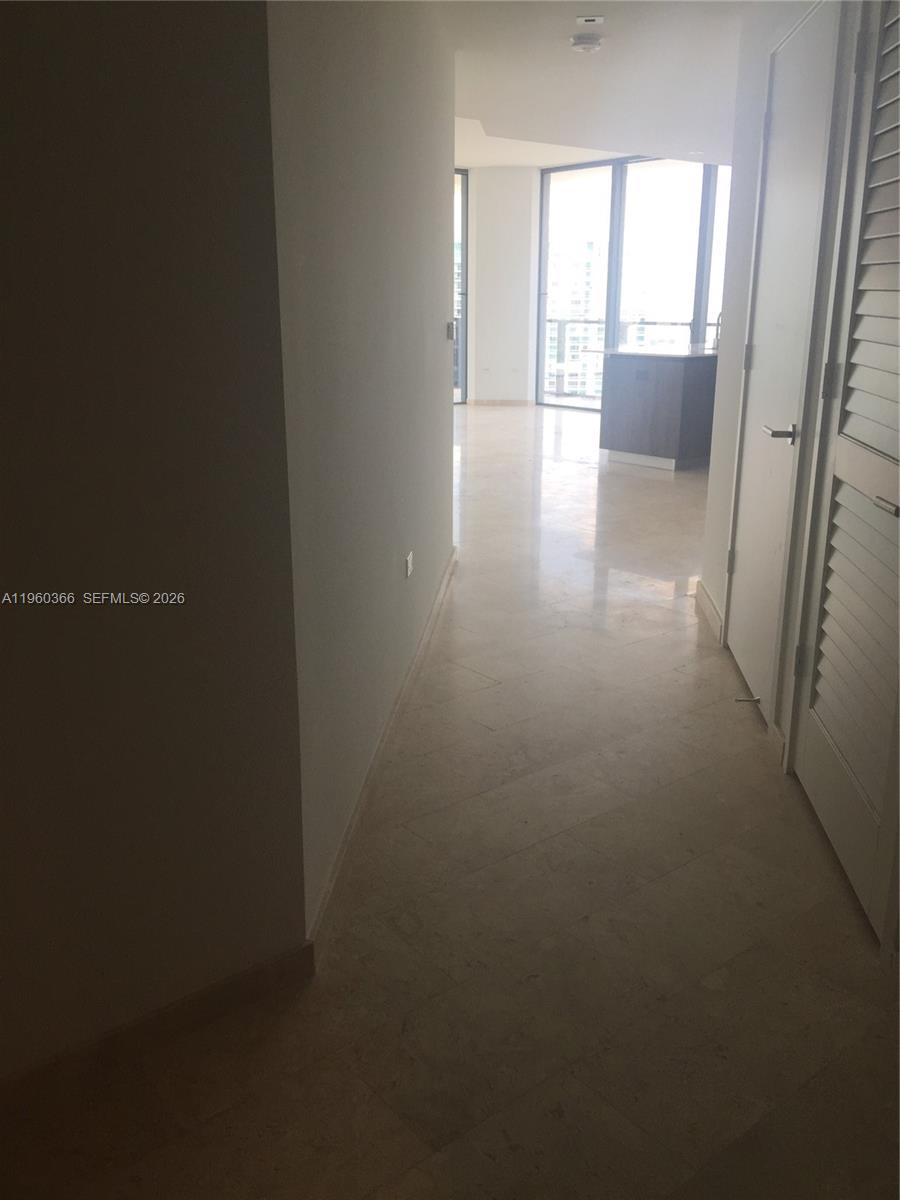 68 Southeast 6th Street, Unit 3412 Miami, FL 33131 - Photo 8 of 13 a view of an empty room and a window