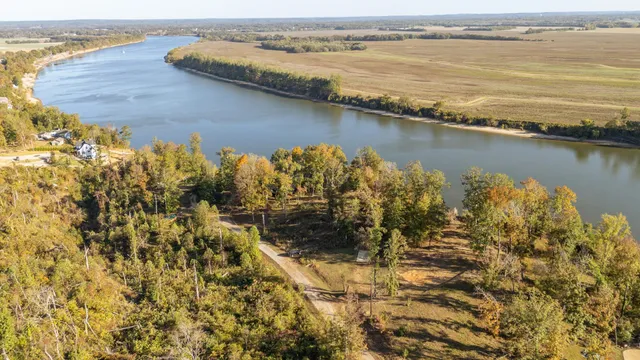 a view of residential space with wooden floor and fence