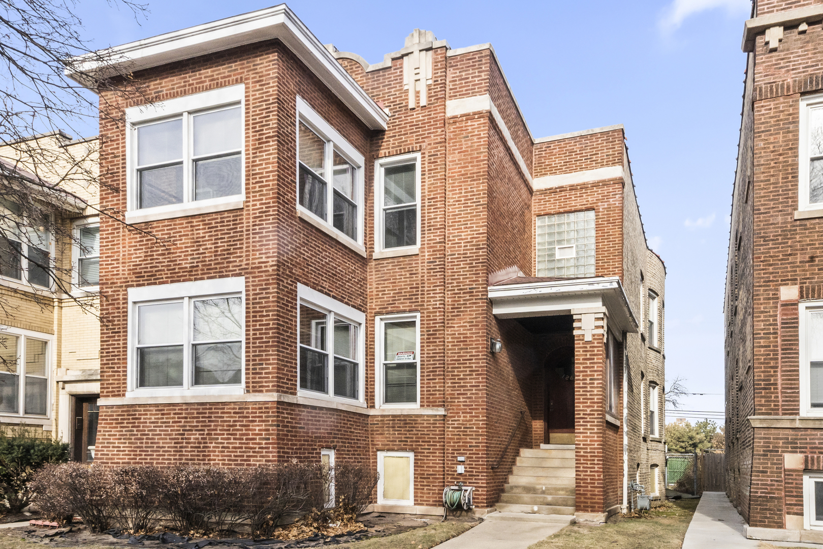 1244 West Arthur Avenue, Unit 2 Chicago, IL 60626 - Photo 1 of 25 a front view of a house