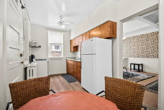 a kitchen with stainless steel appliances granite countertop a refrigerator sink and cabinets