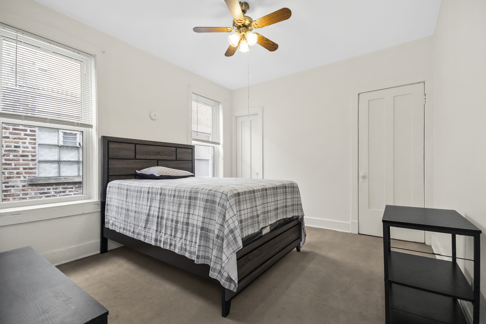 1244 West Arthur Avenue, Unit 2 Chicago, IL 60626 - Photo 13 of 25 a bedroom with a bed and a window