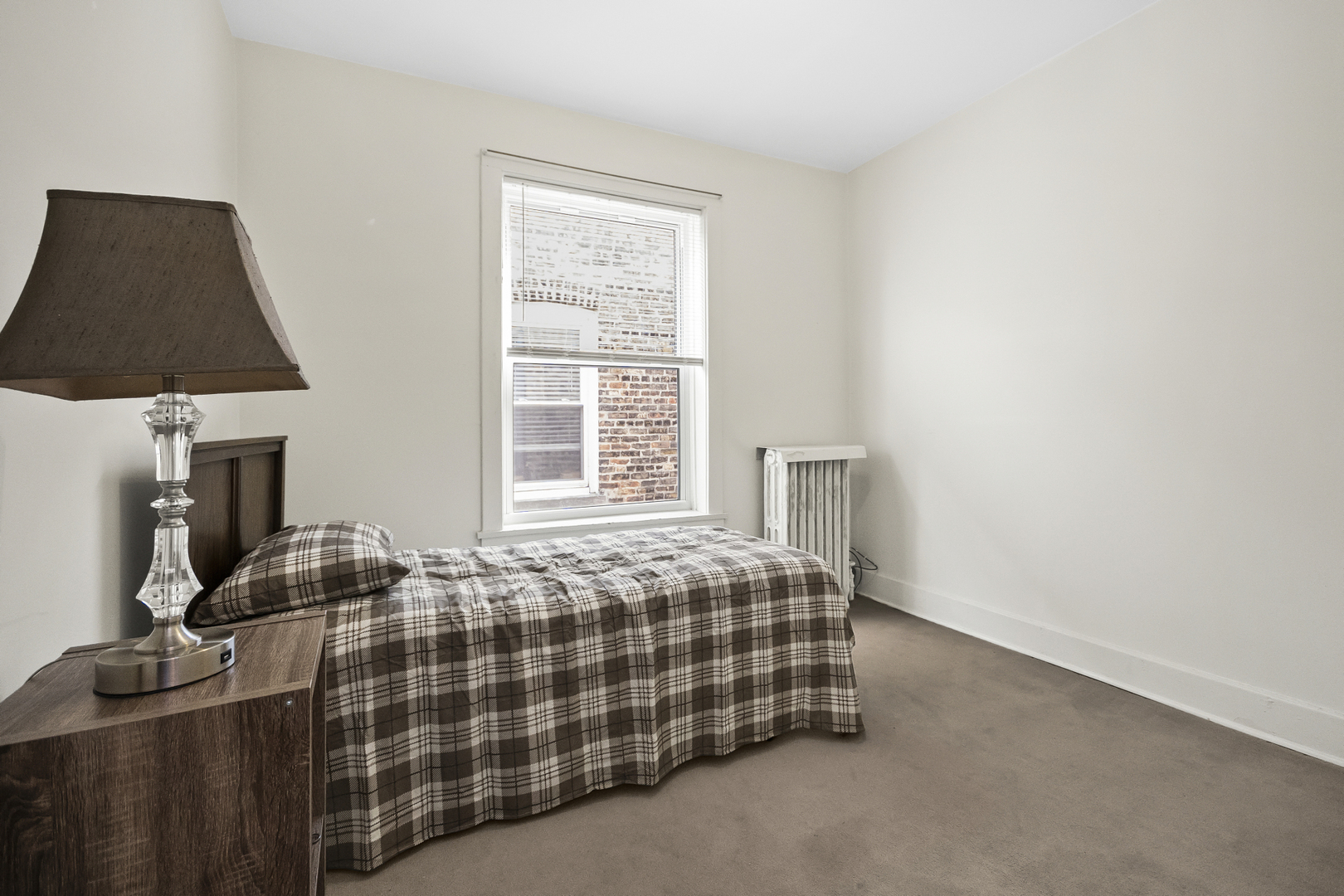 1244 West Arthur Avenue, Unit 2 Chicago, IL 60626 - Photo 14 of 25 a bedroom with a bed and a window