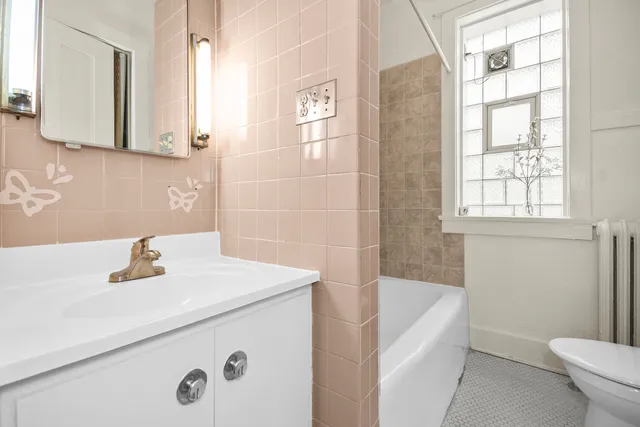 a bathroom with a sink a toilet and a bathtub