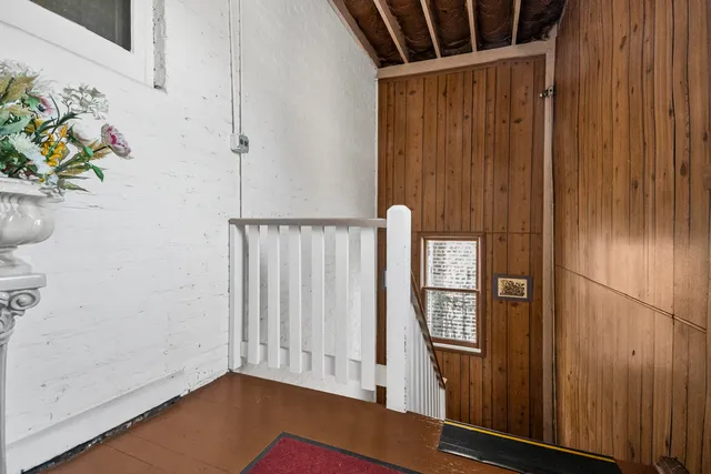 a view of entryway with wooden floor