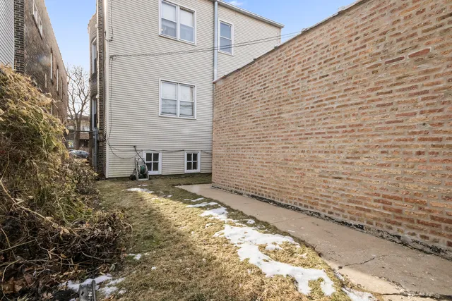 a view of a backyard of a house