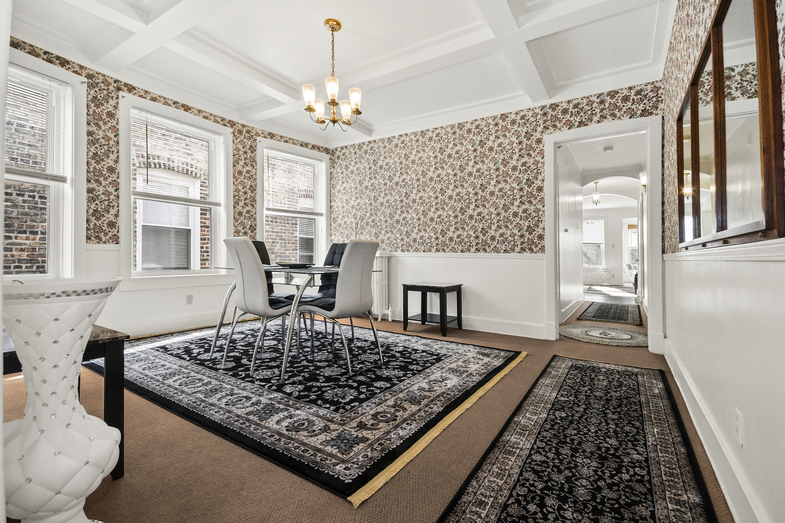 1244 West Arthur Avenue, Unit 2 Chicago, IL 60626 - Photo 7 of 25 a large kitchen with a table and chairs