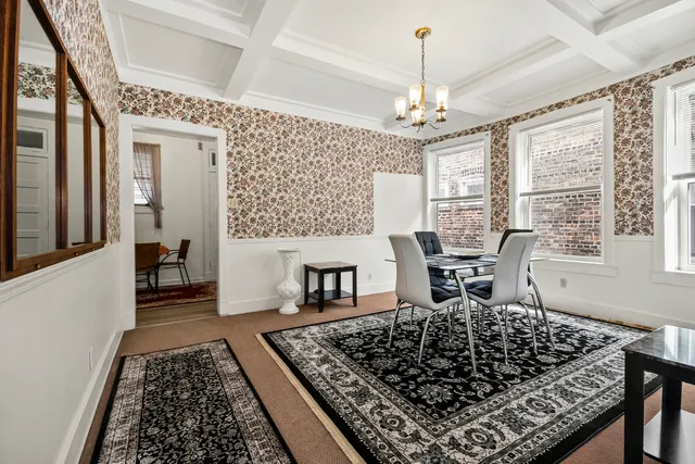 a very nice looking dining room with a rug