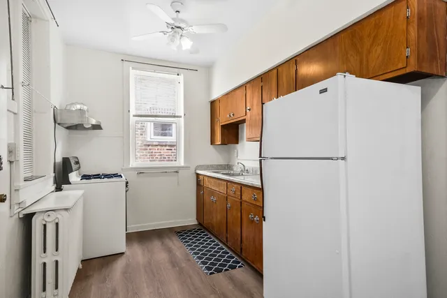 a kitchen with stainless steel appliances a refrigerator sink and stove