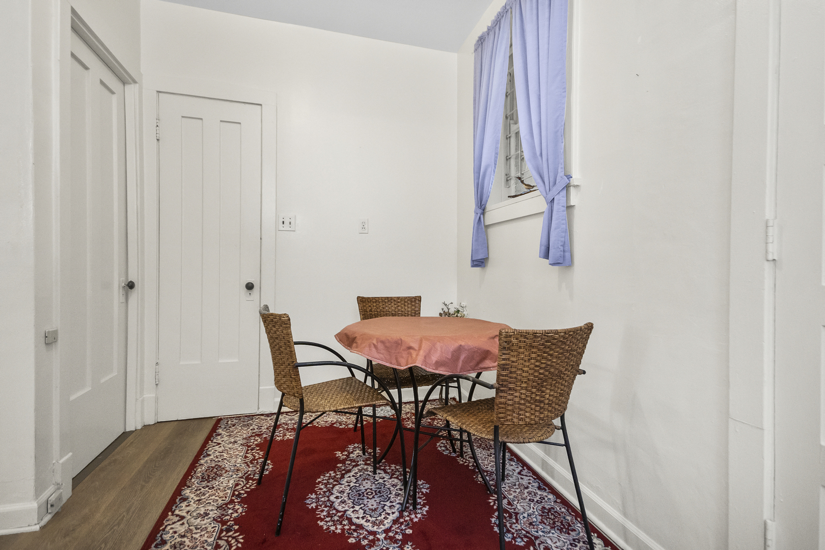 1244 West Arthur Avenue, Unit 2 Chicago, IL 60626 - Photo 10 of 25 a patio with a table and a chair with wooden floor