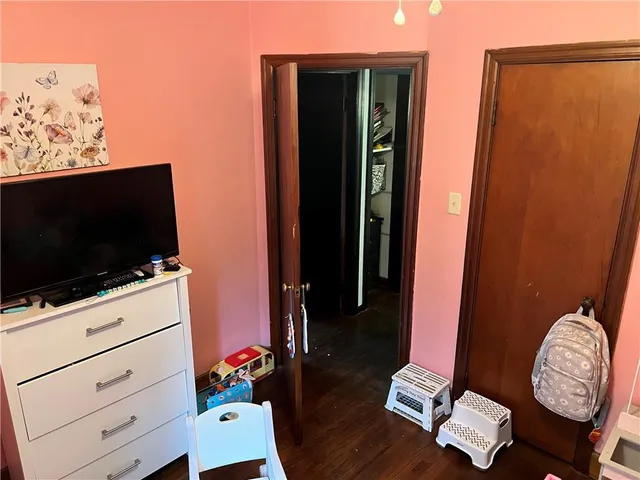 a room with furniture and flat screen tv