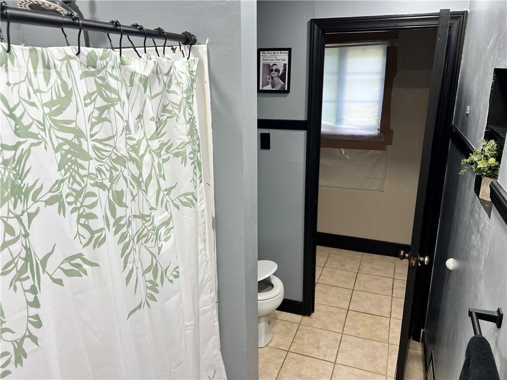 303 Leech Road Greenville, PA 16125 - Photo 14 of 16 a bathroom with a shower and a sink