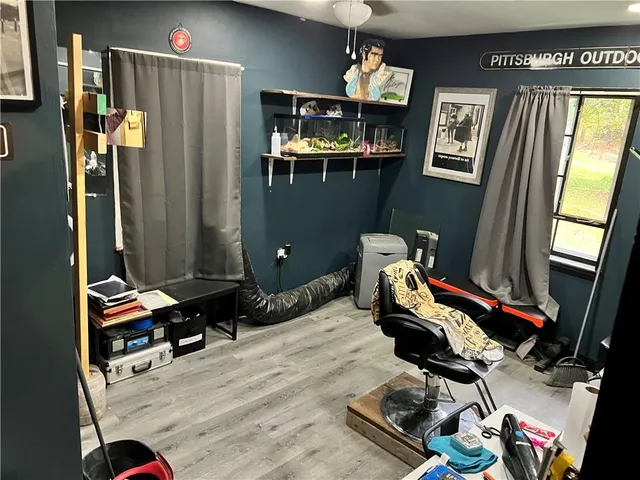 a room with furniture and gym equipment