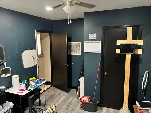 a living room with furniture and a lamp