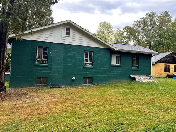 a front view of a house with yard